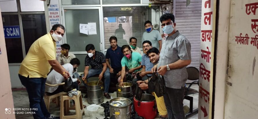 An Entire team engaged in sacred work is delivering food to the needy